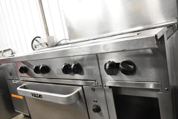 Vulcan 48C-SEFAAA stainless steel 8-burner range with convection oven. Features backsplash, commercial casters, and control knobs.