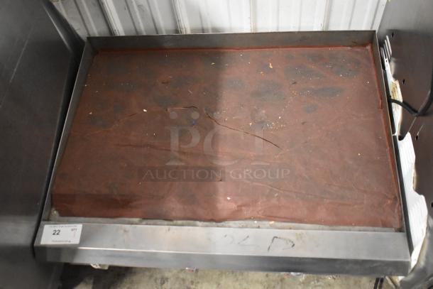 Ikon Stainless Steel Gas Griddle, commercial countertop model. Features flat top, visible wear on surface, label "SOLD" shown.