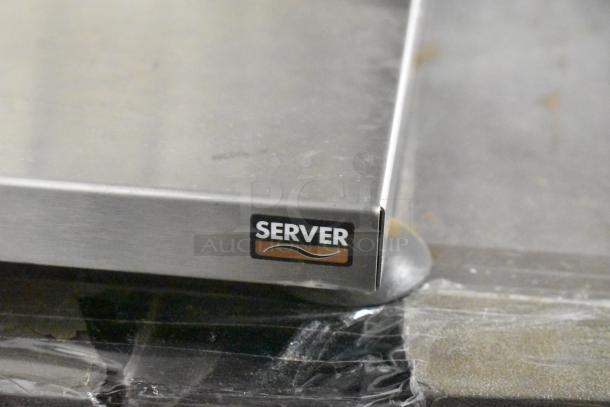 Server metal countertop with two wells for dry food, featuring a visible brand label.