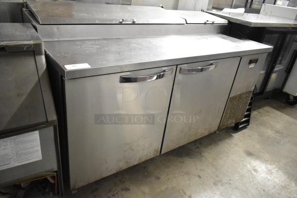 2019 True TPP-67 stainless steel pizza prep table, commercial casters, visible wear. Model TPP-67, 115V, 1 phase.