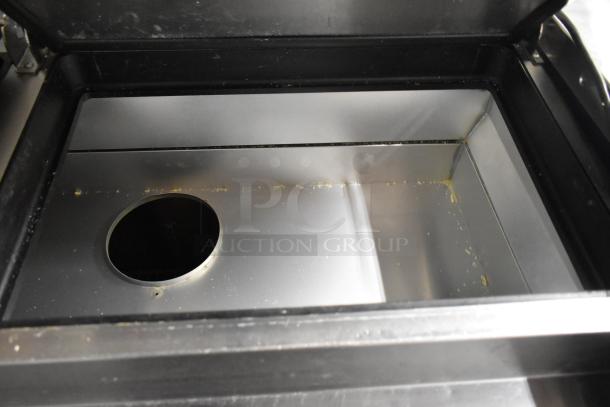 2019 True TPP-67 stainless steel pizza prep table, commercial casters, interior view, 115 volts, 1 phase.