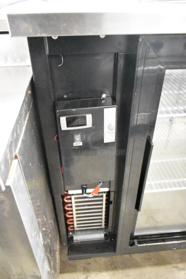 Yukon YBB49-2G-24SD metal 2-door commercial back bar bottle cooler with digital display, showing interior shelves and cooling unit.