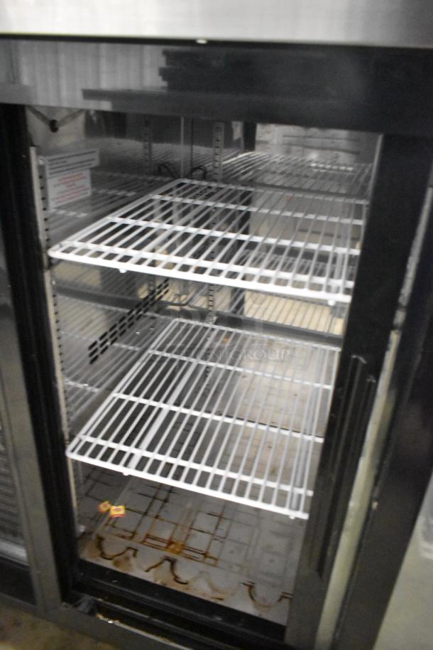 Yukon YBB49-2G-24SD 2 door bar cooler, metal construction, commercial use, shelves visible, requires 115 volts, 1 phase.