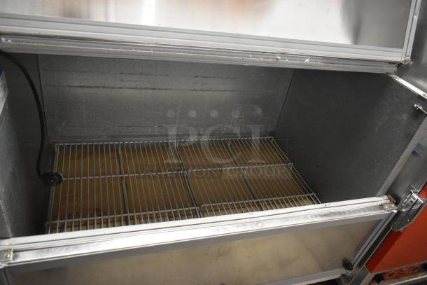 Beverage Air SMF49 stainless steel commercial milk cooler, open top view, with wire shelves and commercial casters.