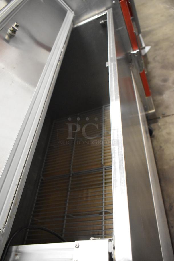 Beverage Air SMF49 stainless steel milk cooler, open interior view, on commercial casters. 115 volts, 1 phase. Appears in good condition.