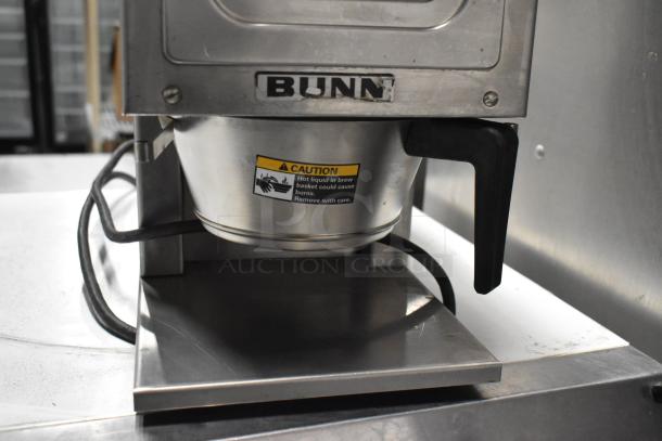 Bunn G-9 commercial coffee grinder, metal build, visible Bunn logo, caution label, 115 volts, used condition.