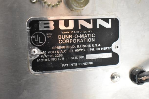 Bunn G-9 metal commercial coffee grinder, 115 volts, 1 phase. Features manufacturer's label detailing specs and model.