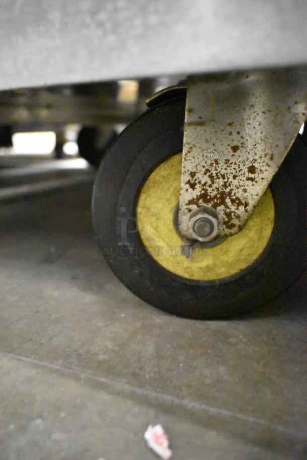 Cres-Cor H1381834 heated holding cabinet caster, showing wear and rust. Durable for commercial use, 120V, 1 phase.