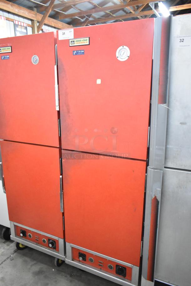 Cres-Cor H1381834 metal commercial heated holding cabinet on casters, red, 120 volts, 1 phase, visible temperature gauges.