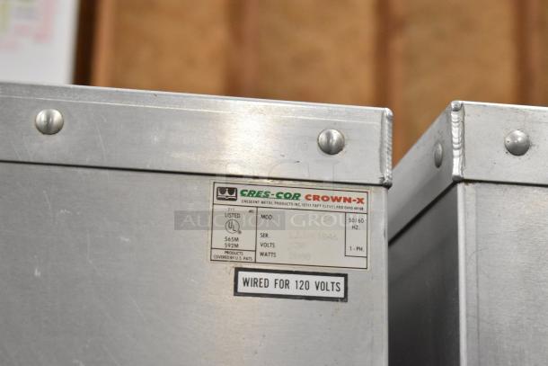 Cres-Cor H1381834 metal heated holding cabinet on casters, 120V, 1 phase, features manufacturer label with model and voltage.