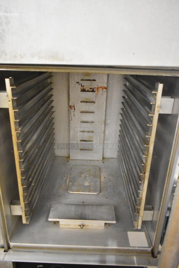 Cres-Cor 5495 039 metal heated holding cabinet on casters, 120V, 1 phase, interior racks, visible wear inside.