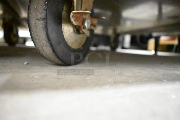 Cres-Cor 5495 039 heated holding cabinet with commercial casters, showing a close-up of one caster.