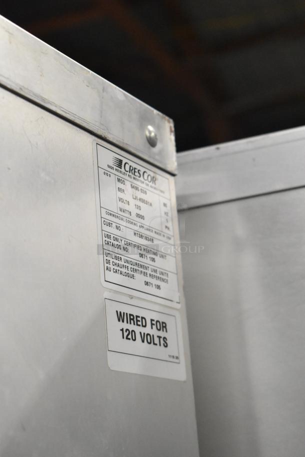 Cres-Cor 5495 039 metal heated holding cabinet, 120 volts, 1 phase, on commercial casters. Features visible labels.
