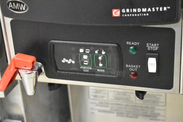 Grindmaster Grind'n Brew-10H coffee maker with hot water dispenser, control panel with portion size and mode settings visible.