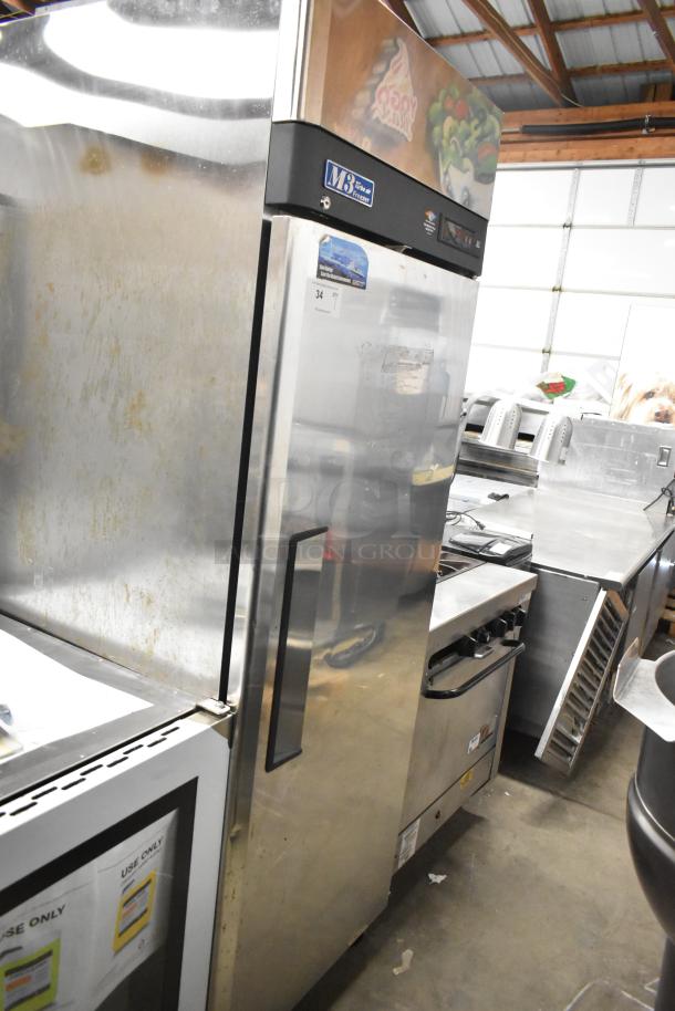 Turbo Air M3F24-1 stainless steel commercial freezer, single door, poly coated racks, on commercial casters.