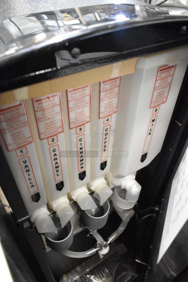 Cecilware GB5MFIT metal commercial cappuccino machine with labeled compartments for vanilla, caramel, cinnamon, coffee, and milk.