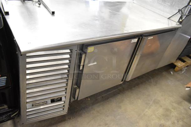 Traulsen UC2HT stainless steel 2-door undercounter cooler, 115V, 1 phase, with vented panel, commercial kitchen equipment.