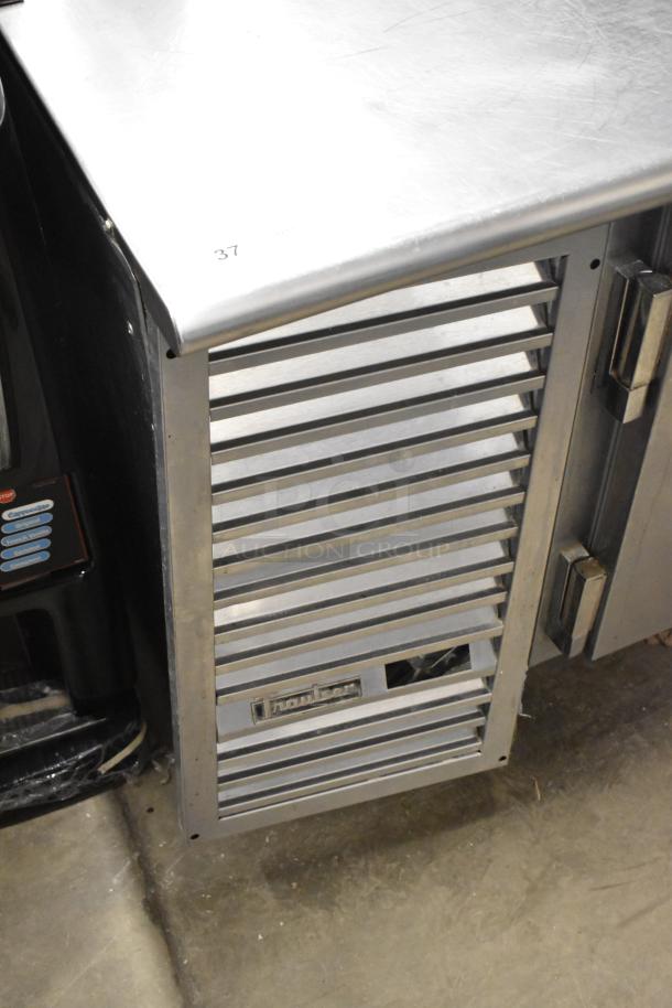 Traulsen UC2HT stainless steel commercial 2-door undercounter cooler, logo visible, 115 volts, 1 phase, good condition.
