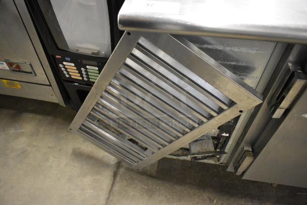 Traulsen UC2HT stainless steel 2-door undercounter cooler, 115 volts, showing front panel removed, commercial use.