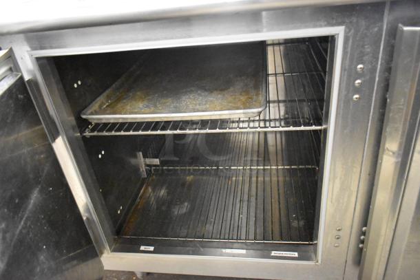 Traulsen UC2HT stainless steel 2-door undercounter cooler, 115V, with shelves, commercial use, decent condition.