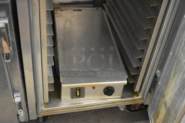 EPCO INSA61618H metal heated holding cabinet with shelves, control knob, and indicator light. 120V, 1 Phase. On casters.