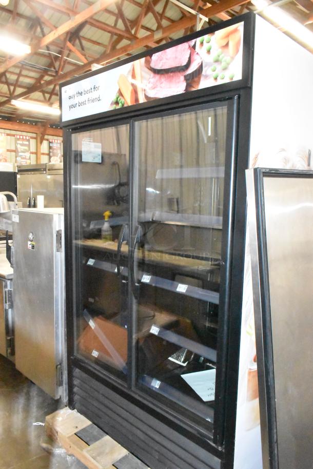 2022 True TVM-48SL-HC 2 Door Commercial Reach-In Cooler with metal shelves, 115V, 1 Phase, Excellent condition.