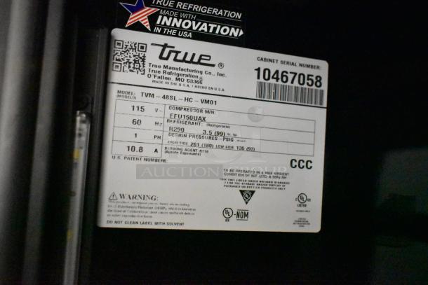 2022 True TVM-48SL-HC commercial cooler label, 2-door, metal shelves, 115V, 1 phase, UL listed, model details visible.
