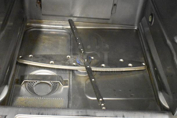 2023 Hobart LXER stainless steel undercounter dishwasher interior, showing spray arm and filter. Excellent condition.