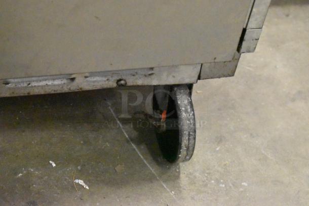 Beverage Air stainless steel prep table with Bain Marie mega top, on commercial casters. Used condition, 115V, 1 phase.