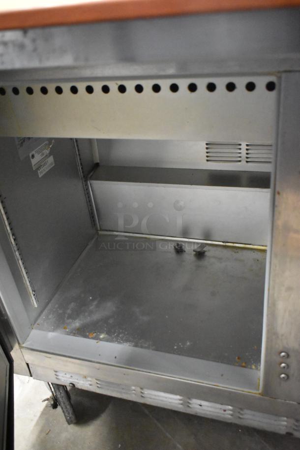 Beverage Air stainless steel commercial sandwich salad prep table, model Mega Top, with bain marie and commercial casters.