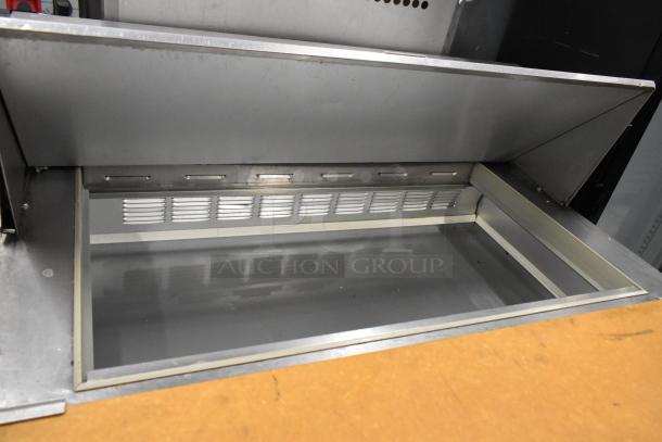 Beverage Air stainless steel sandwich prep table with mega top, commercial casters, 115V, 1 phase, new condition.