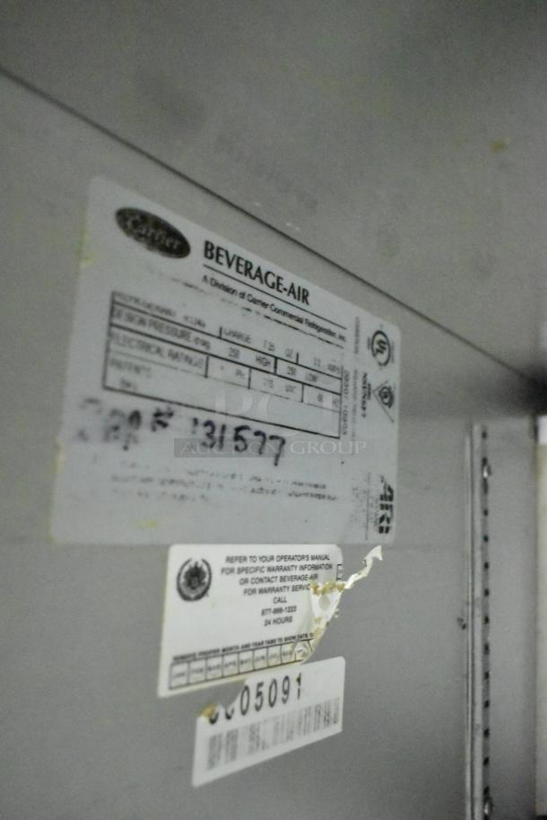 Beverage Air stainless steel commercial prep table, 115V, 1 phase, with tags showing specifications and serial number.