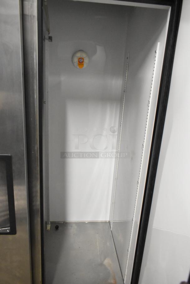 True T-35 stainless steel commercial cooler interior, 2-door, 115V, 1 phase, visible shelving tracks, clean condition.