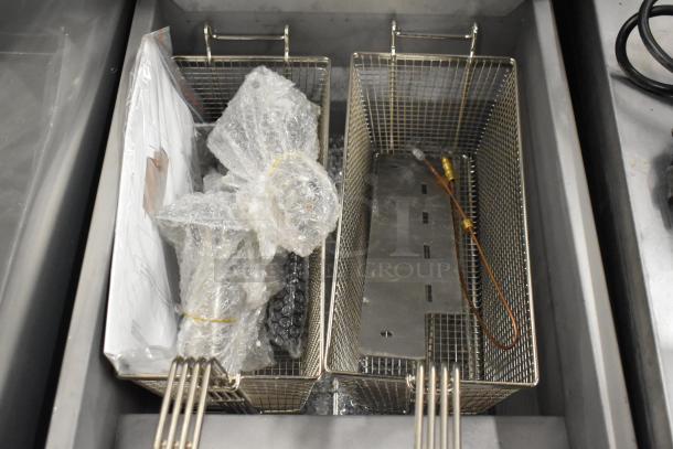 BRAND NEW Vulcan LG300-2 stainless steel fryer with two metal baskets, packaged accessories, and 90,000 BTU capacity.