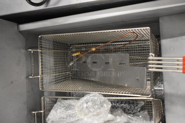 BRAND NEW Vulcan LG300-2 stainless steel propane fryer with two metal baskets, 90,000 BTU, slight scratches.