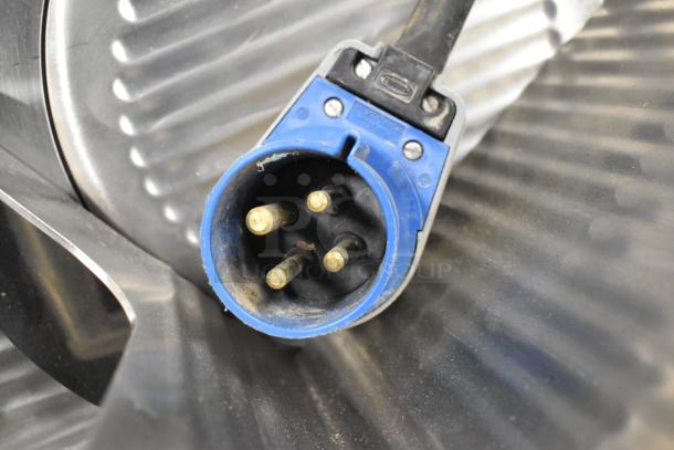 Close-up of a blue three-phase electrical plug for Garland MCOE5LDSMD commercial convection oven.