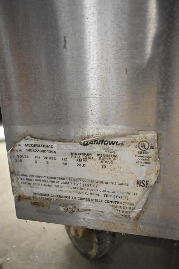 Garland MCOE5LDSMD stainless steel convection oven, half size, electric, 208V, 3 phase, on casters, with visible label details.