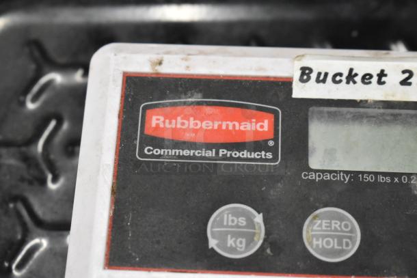 Rubbermaid scale with 150 lb capacity, used condition, features lb/kg toggle and zero hold button, commercial product label visible.