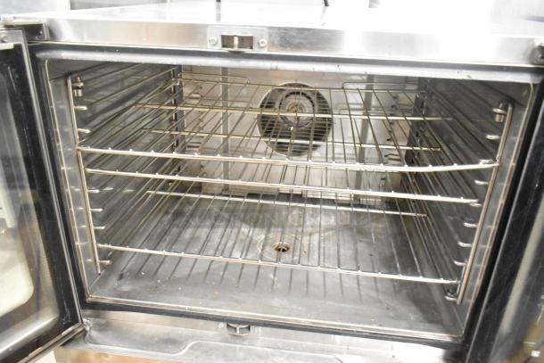 Blodgett Hydrovection Helix stainless steel full-size convection oven with view-through doors and metal racks visible.