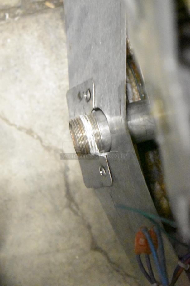 A close-up of a metal component on a Blodgett Hydrovection Helix stainless steel convection oven, showing wiring and a threaded connector.