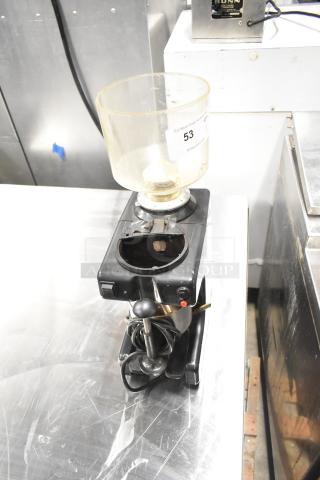 Bregani metal commercial countertop espresso bean grinder, missing lid. Black finish, 120 volts, 1 phase, auction tag labeled "53".