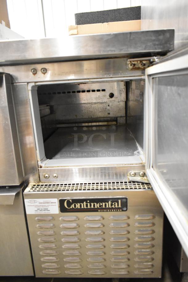 2017 Continental CPA68 stainless steel pizza prep table, 2 drawers, 2 doors, on commercial casters, 115 volts, 1 phase.