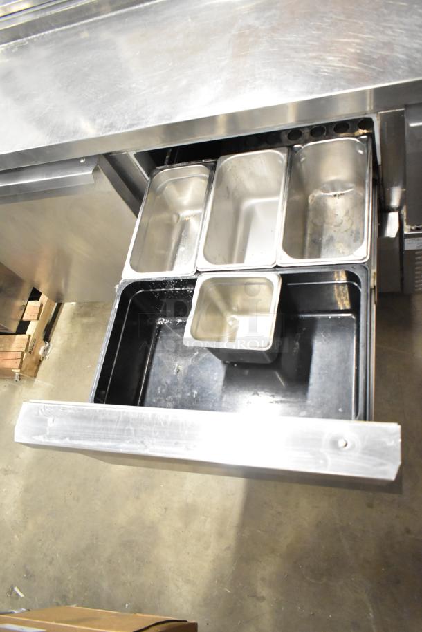 2017 Continental CPA68 stainless steel pizza prep table with 2 drawers, 2 doors, and commercial casters, 115V, 1 Phase.