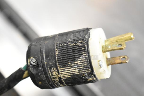 Close-up of a used power plug from a 2017 Continental CPA68 Stainless Steel Commercial Pizza Prep Table, showing wear and connectors.