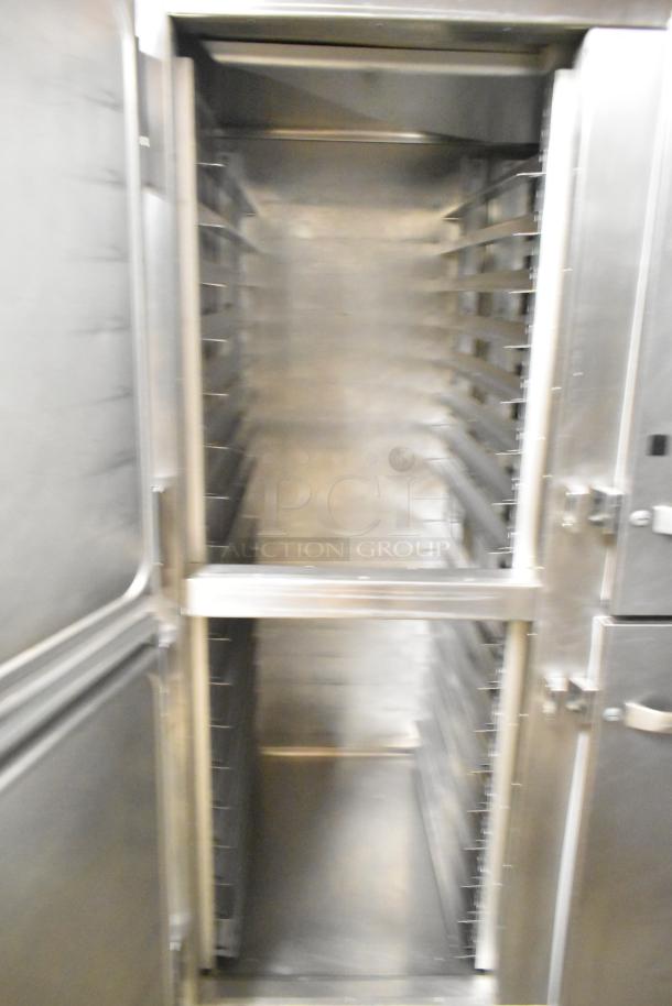 Traulsen RHT 2-32NUT stainless steel 2-door reach-in cooler, commercial casters, 115 volts, 1 phase, clean interior condition.