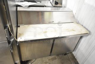 Beverage Air SPE48HC-12C stainless steel commercial sandwich salad prep table, commercial casters, 115V, fair condition.