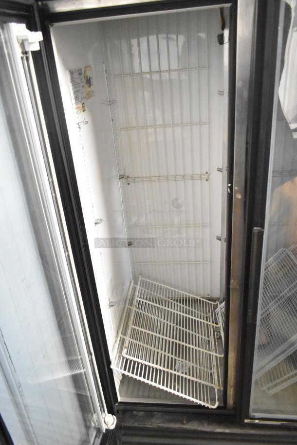 True GDM-35F commercial 2-door freezer merchandiser with poly-coated racks, 115V, 1 Phase, metal exterior, open door view.