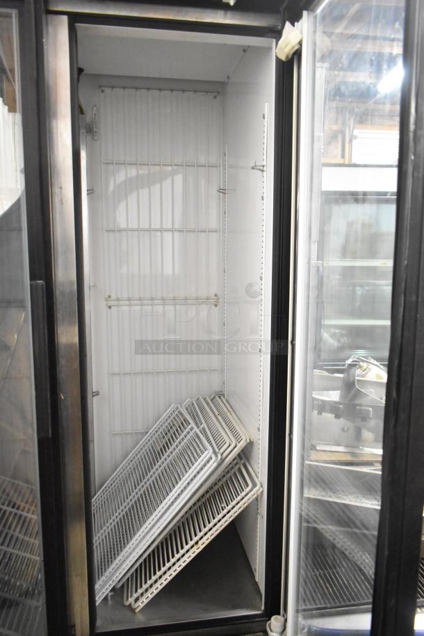 True GDM-35F metal commercial 2-door reach-in freezer with poly coated racks, 115 volts, 1 phase, in used condition.