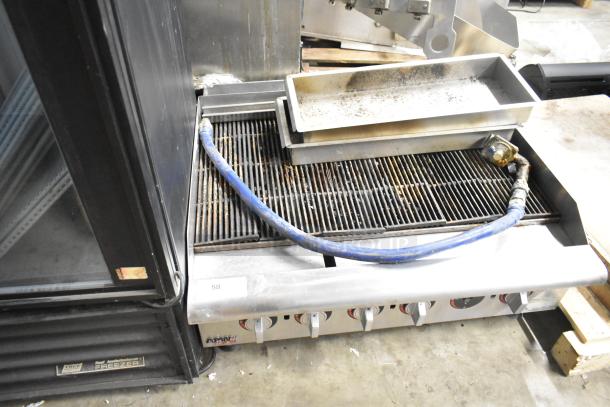 APW Wyott HCRB-2436i stainless steel charbroiler grill, natural gas, countertop model, used condition, visible controls.