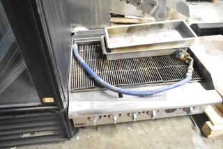APW Wyott HCRB-2436i stainless steel charbroiler grill, natural gas, countertop model, used condition, visible controls.